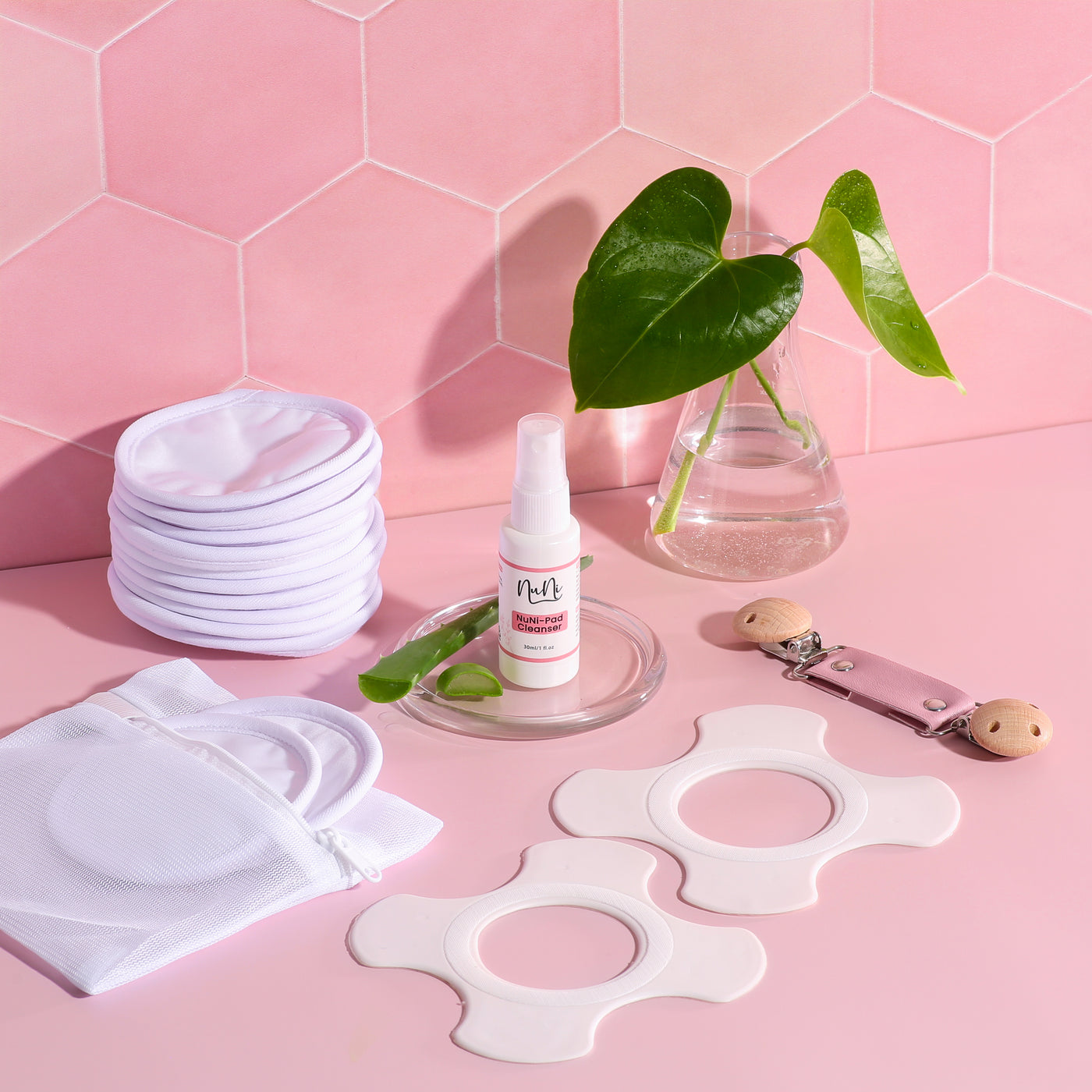 NuNi Stilleinlagen, Stillpads, Reinigungsspray und Stillclip in rosa